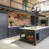 Modern kitchen with brick walls and central island design.